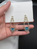 AndQ Blue Transparent Zircon Embedded Heart Earrings